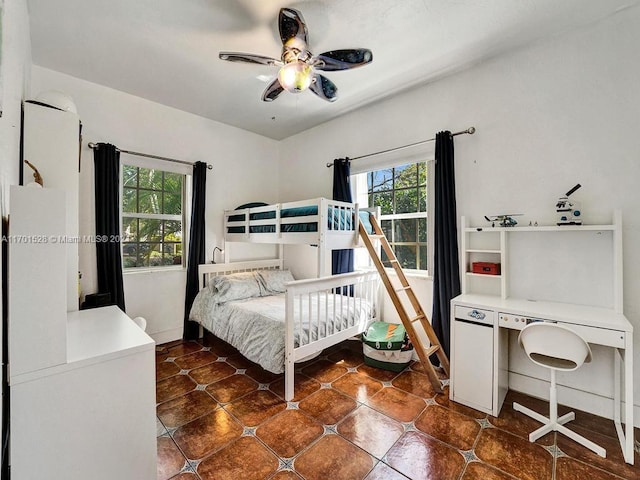 tiled bedroom with ceiling fan