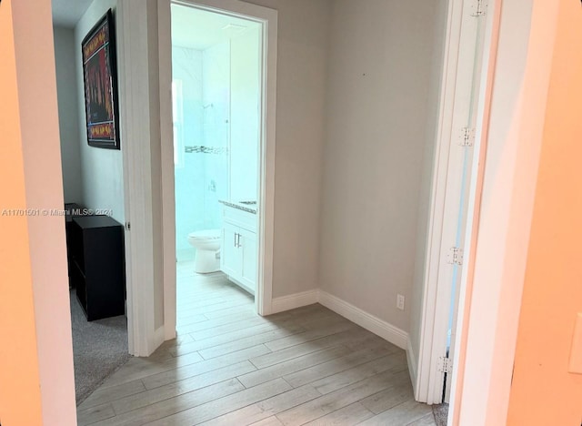 hallway featuring light hardwood / wood-style flooring