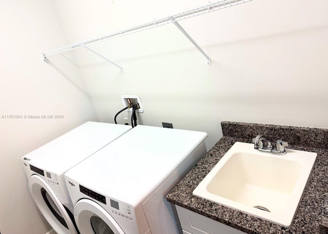 washroom featuring separate washer and dryer and sink