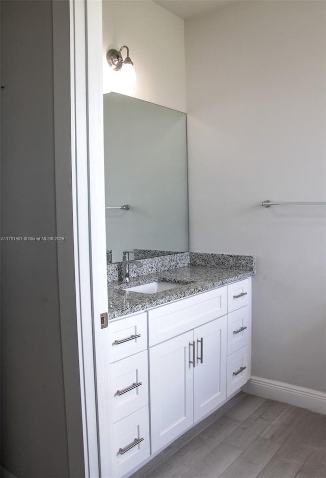 5231 NW Iredell St, Port St Lucie, FL 34986 - bathroom with vanity and baseboards