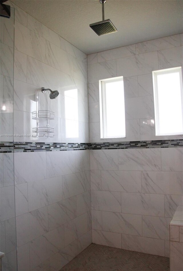 5231 NW Iredell St, Port St Lucie, FL 34986 - bathroom with a stall shower, vanity, and baseboards