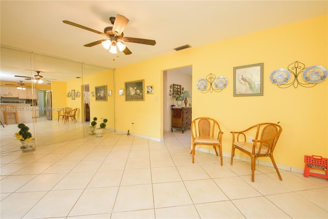 living area featuring light tile patterned flooring