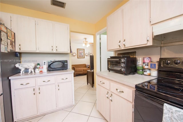 kitchen featuring black appliances, ceiling fan, white cabinetry, and light tile patterned floors