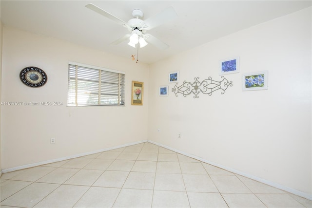 tiled empty room with ceiling fan