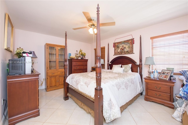 bedroom featuring ceiling fan and light tile patterned floors