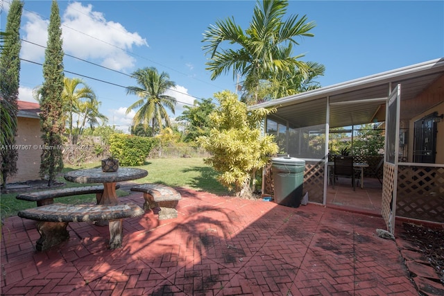 view of patio / terrace with a sunroom