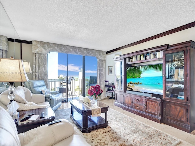 living room featuring light tile patterned floors, a textured ceiling, and crown molding