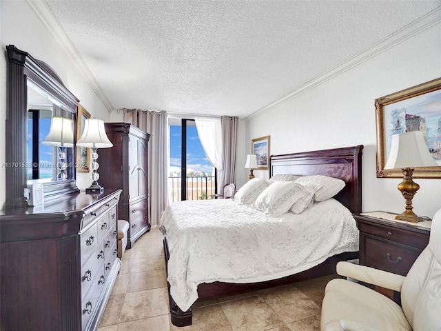 tiled bedroom featuring access to exterior, a textured ceiling, and ornamental molding