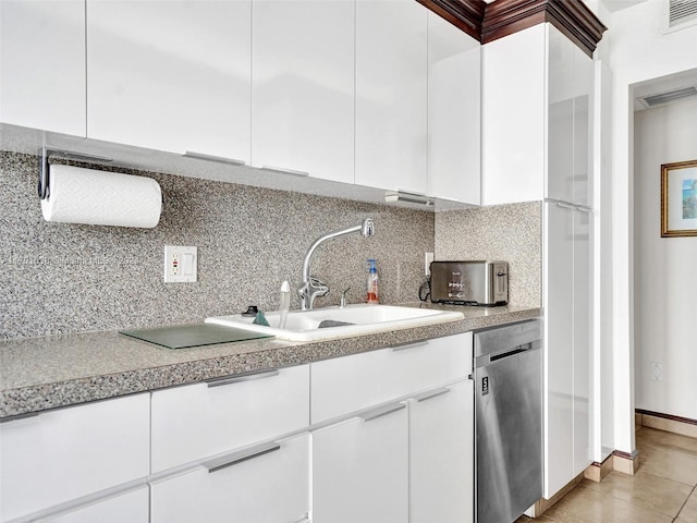 kitchen featuring dishwasher, white cabinetry, sink, and tasteful backsplash