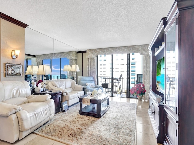 living room with light tile patterned floors, a textured ceiling, and a wealth of natural light