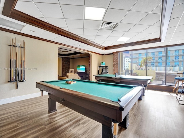 game room featuring hardwood / wood-style flooring, a drop ceiling, a raised ceiling, and pool table