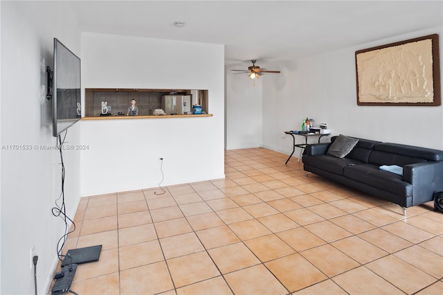 tiled living room with ceiling fan