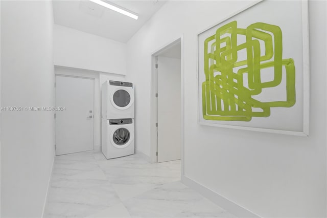 laundry area featuring stacked washer and clothes dryer