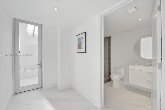 bathroom with vanity and toilet