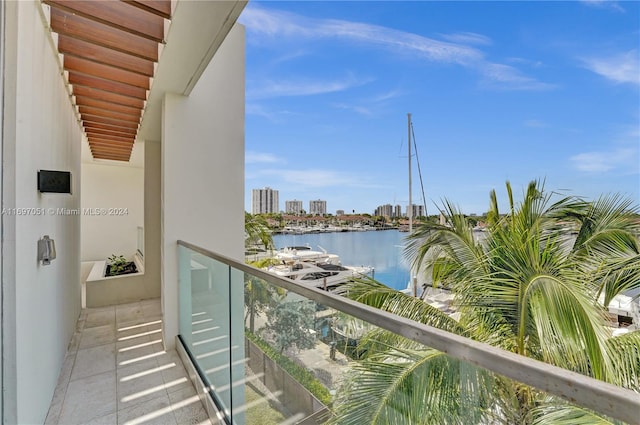 balcony featuring a water view