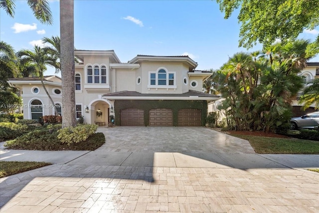 mediterranean / spanish-style house featuring a garage