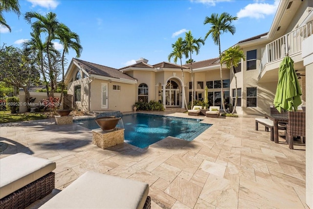 view of swimming pool with a patio