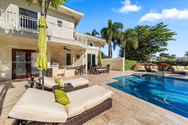 view of pool with french doors, a patio, and ceiling fan