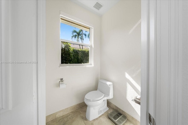 bathroom featuring toilet