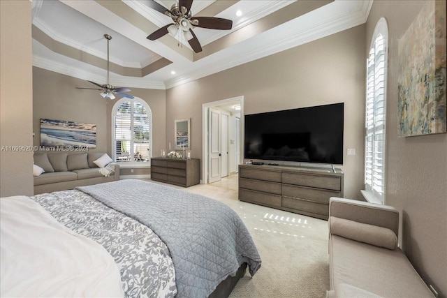 carpeted bedroom featuring ceiling fan, a raised ceiling, and ornamental molding