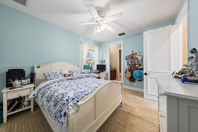 bedroom featuring ceiling fan and light colored carpet