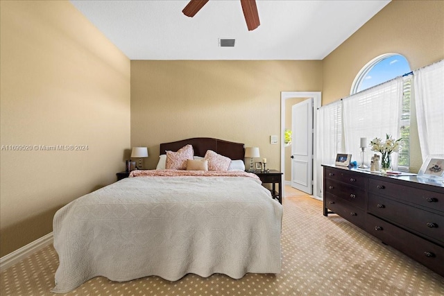 carpeted bedroom with ceiling fan