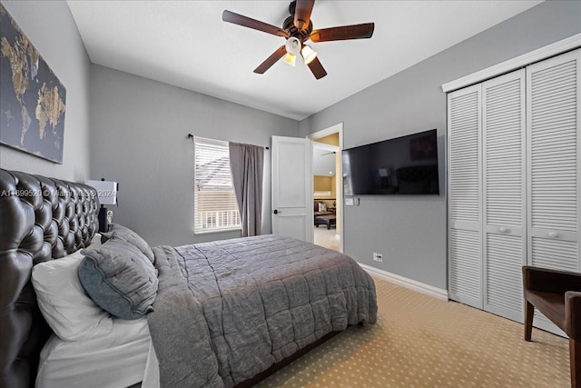 bedroom with light carpet, a closet, and ceiling fan