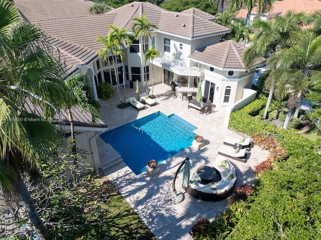 view of swimming pool with an outdoor living space and a patio