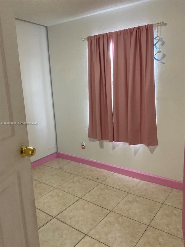 empty room featuring tile patterned flooring