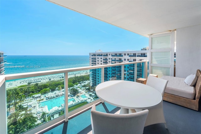 balcony featuring a water view