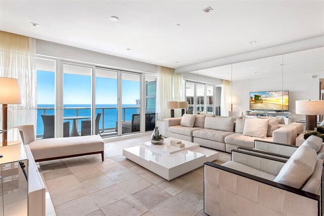 bedroom featuring multiple windows and access to exterior