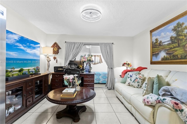 tiled living room with a textured ceiling