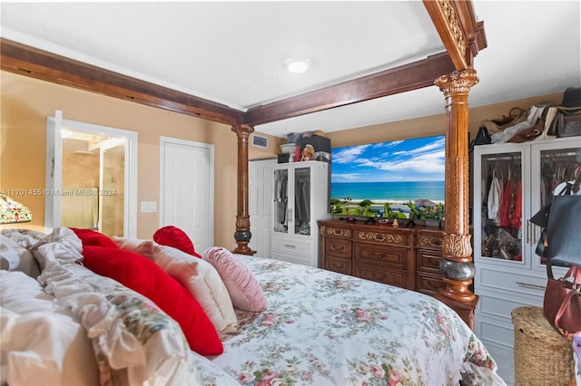 bedroom featuring decorative columns