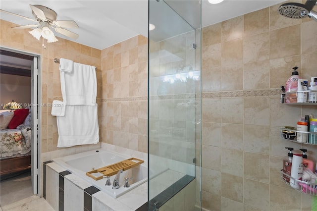 bathroom with ceiling fan, shower with separate bathtub, and tile walls