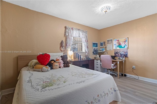 bedroom featuring hardwood / wood-style floors