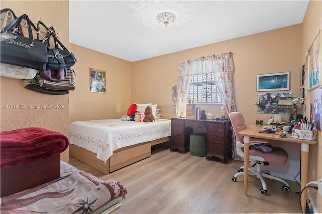 bedroom with light hardwood / wood-style floors