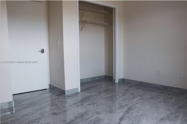 unfurnished bedroom featuring a closet