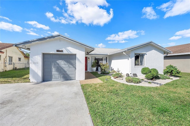 single story home featuring a front yard and a garage