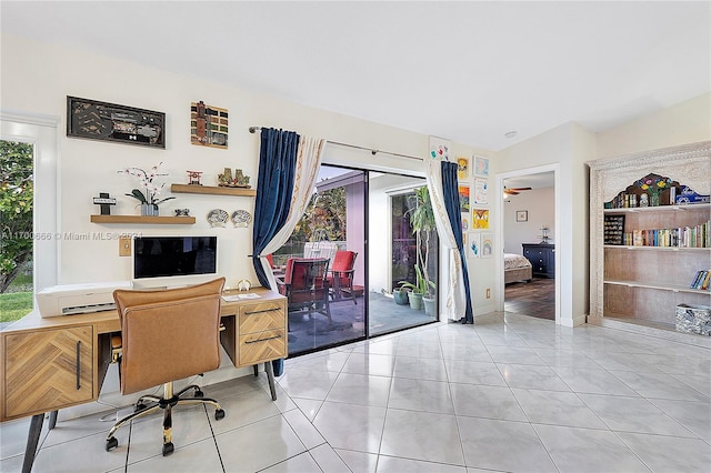 tiled office with ceiling fan and lofted ceiling