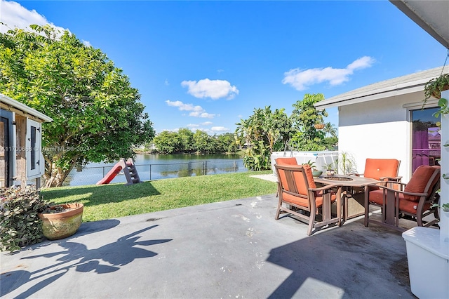 view of patio / terrace with a water view