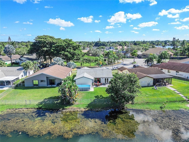 birds eye view of property with a water view