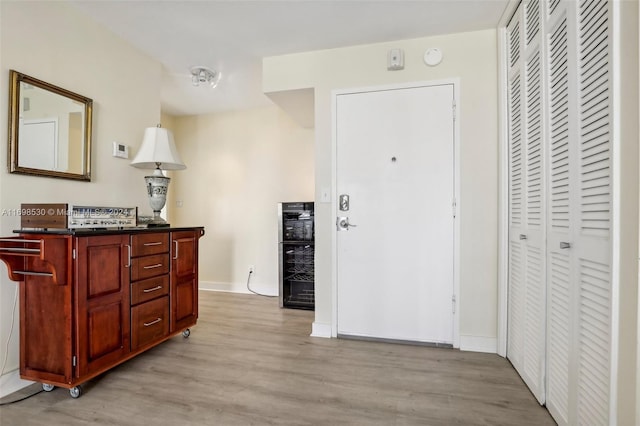 foyer with light hardwood / wood-style floors