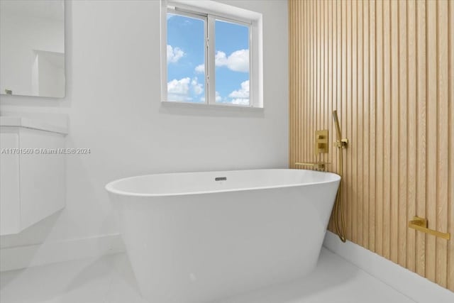 bathroom featuring a bathtub and tile patterned flooring