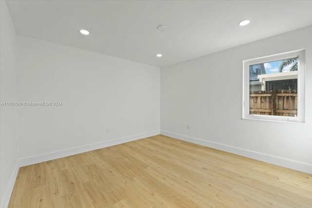 spare room with light hardwood / wood-style floors