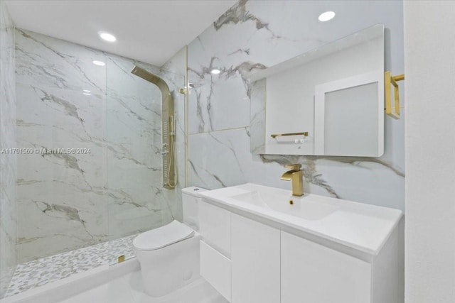 bathroom featuring tiled shower, decorative backsplash, toilet, vanity, and tile walls