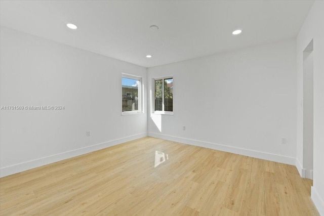 spare room featuring light wood-type flooring