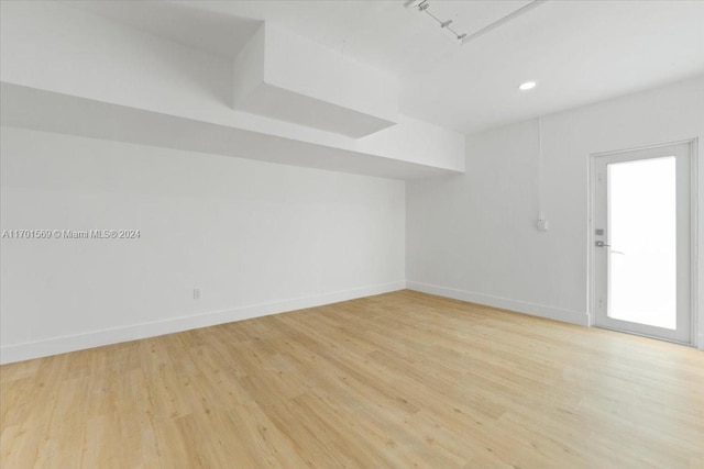 spare room featuring light hardwood / wood-style floors