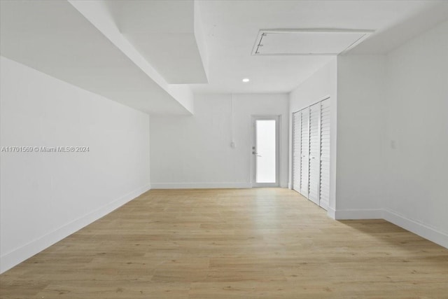 spare room featuring light wood-type flooring