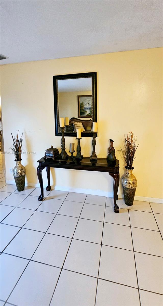17352 SW 18th St, Miramar, FL 33029 - detailed view of baseboards and a textured ceiling