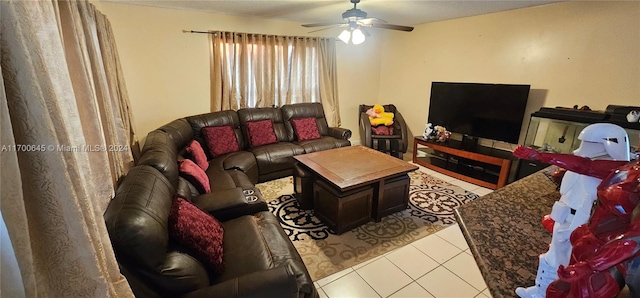 tiled living room featuring ceiling fan